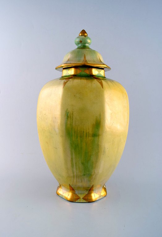 Josef Ekberg for Gustavsberg. Large art deco bojan / lidded jar in green and 
yellow glaze with gold decoration.
