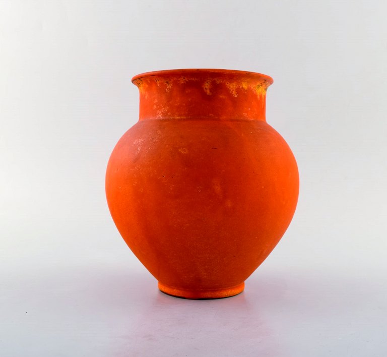 Svend Hammershøi for Kähler, Denmark. Vase in glazed stoneware. Beautiful orange 
uranium glaze. 1940