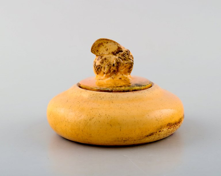 Kähler, Denmark. Lidded jar with bee in glazed ceramics. Beautiful uranium 
yellow glaze. Dated 1914.