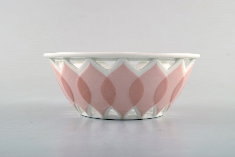 Bjørn Wiinblad for Rosenthal. "Lotus" porcelain service. Pierced bowl decorated 
with pink lotus leaves. 1980