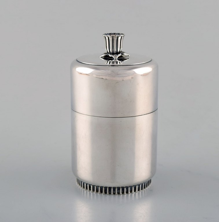 Tore Eldh, Swedish silversmith. Lidded silver container. Minimalist style. Lid 
with enamel work. Dated 1956.
