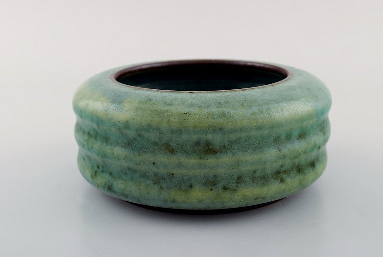 Nylund & Krebs for Saxbo. Early and rare art deco jar in a grooved design. 
Beautiful glaze in turquoise shades. Dated 1929-30.
