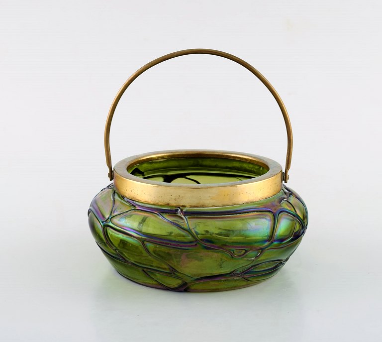 Lötz art nouveau bowl in green art glass with brass mounting and handle. 
Austria, early 20th century.
