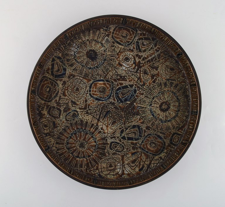 Nils Thorsson for Royal Copenhagen. Large round dish in glazed faience. Dated 
1975-79.
