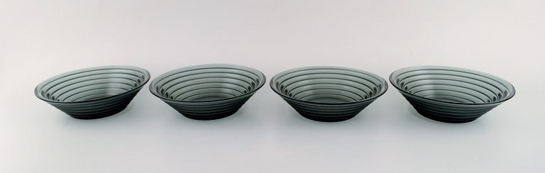 Aino Aalto for Iittala. Four bowls in blue green mouth blown art glass. Finnish 
design, 21 c.
