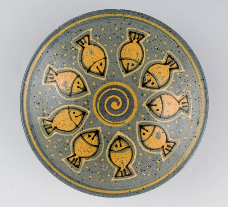 European studio ceramist. Unique bowl in glazed ceramics decorated with fish. 
1970