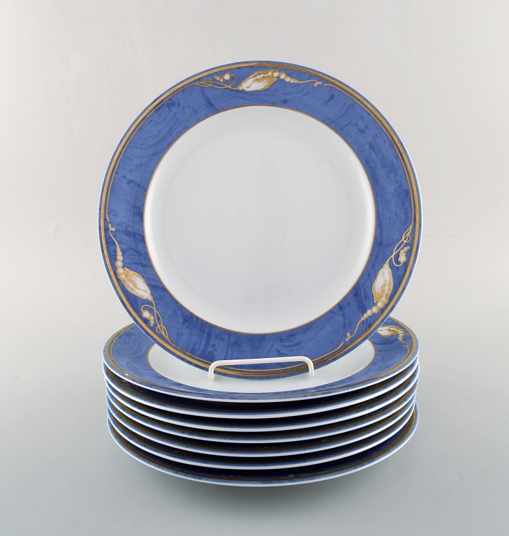 8 Royal Copenhagen "Magnolia" dinner plates. Late 20th century.
