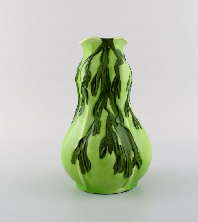 Gunnar Wennerberg for Gustavsberg. Unique art nouveau vase in glazed ceramic. 
Dark green branches on light green background. Dated 1906.
