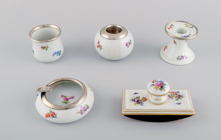 Five parts Meissen porcelain with hand-painted floral motifs, gold decoration 
and sterling silver fittings. 20th century.
