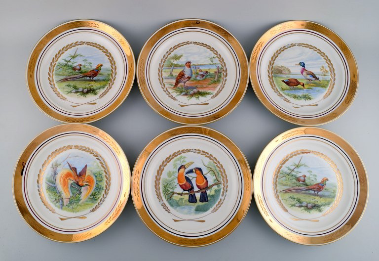 Royal Copenhagen. Set of six large dinner / decoration plates with hand painted 
bird motifs. Dated 1959.
