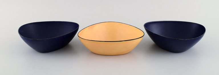 Kockum, Sweden. Three bowls in dark blue and yellow enamel. 1970s.
