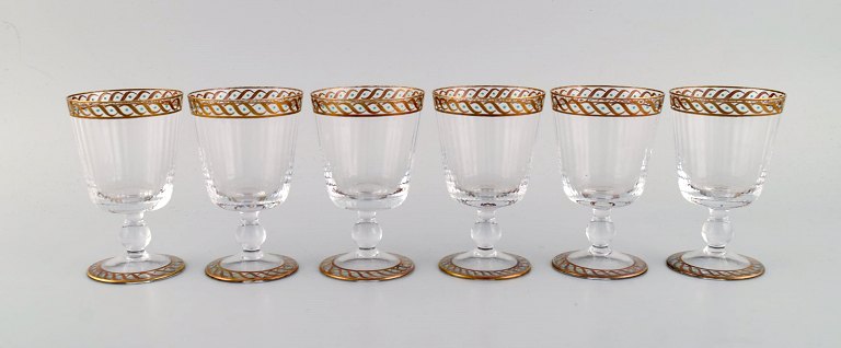 Nason & Moretti, Murano. Six white wine glasses in mouth-blown art glass with 
hand-painted turquoise and gold decoration. 1930s.
