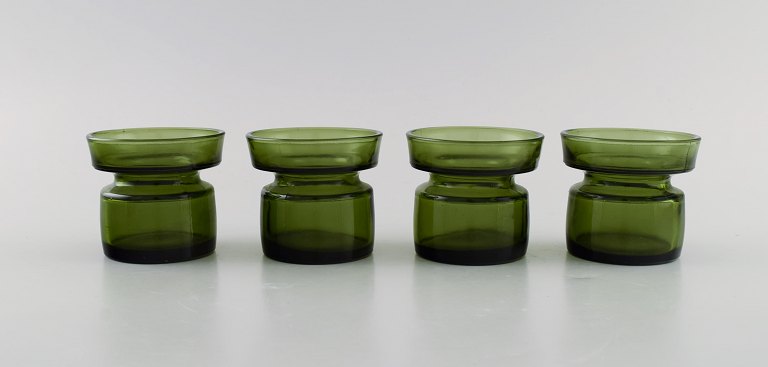 Jens Harald Quistgaard. Fire "Hyggelys" til fyrfadslys i mørkegrønt kunstglas. 
Retro, 1960