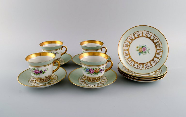 Bing & Grøndahl coffee service for four people. Flowers and gold decoration on 
light green background. 1960s.
