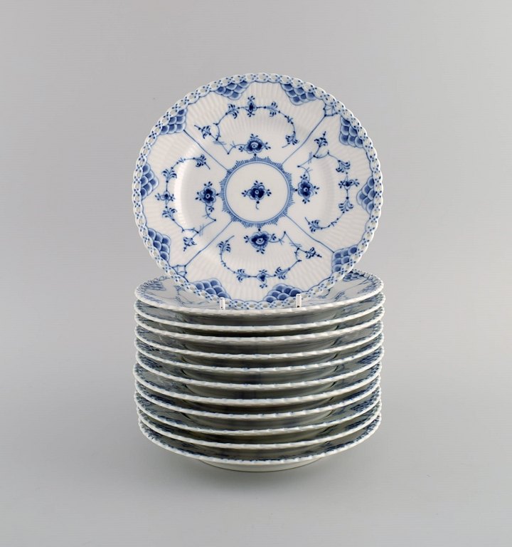 12 Royal Copenhagen Blue Fluted Full Lace Plates. Model number 1/1087. Mid 20th 
century.
