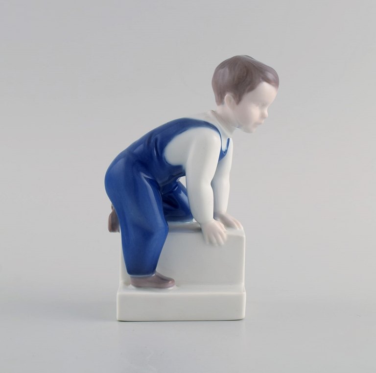 Claire Weiss for Bing & Grøndahl. Porcelain figure. Boy. 1970s. Model number 
2399.
