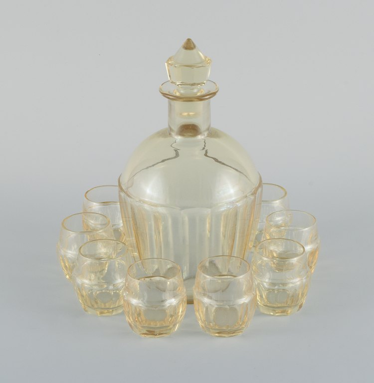 Daum, France, art deco decanter and set of eight liqueur glasses in faceted 
smoke colored art glass.