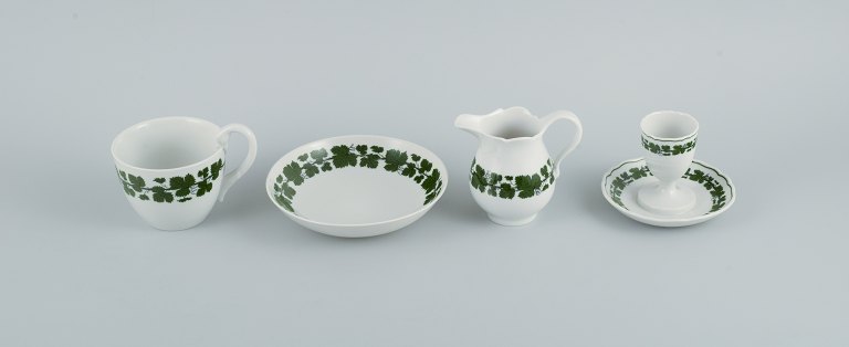 Meissen. Green Ivy Vine. Four parts consisting of egg cup, cup, saucer and cream 
jug.
