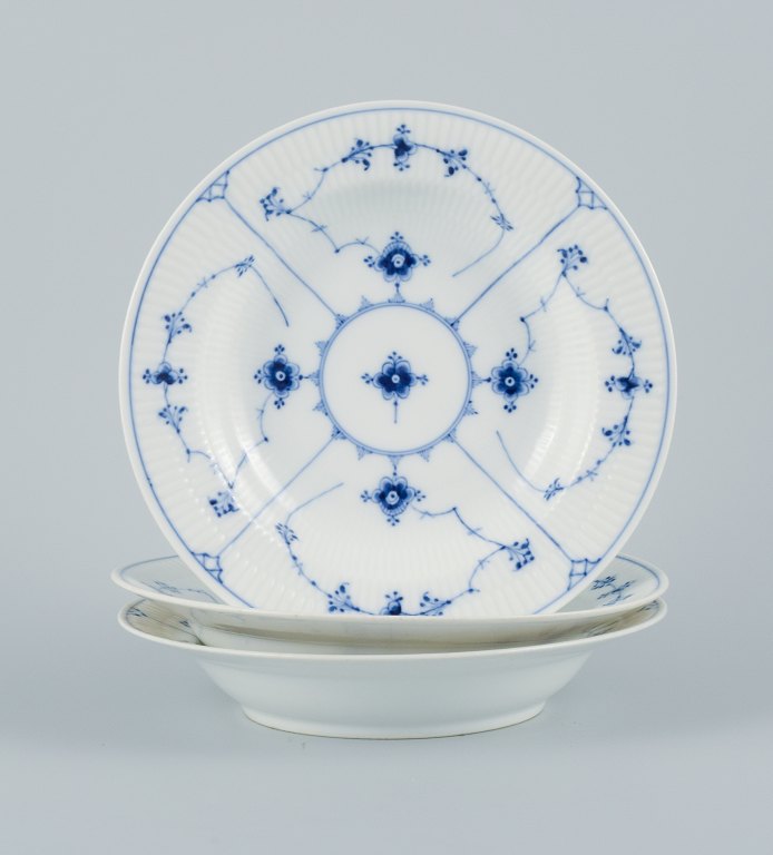 Royal Copenhagen, three Blue fluted plain deep plates.