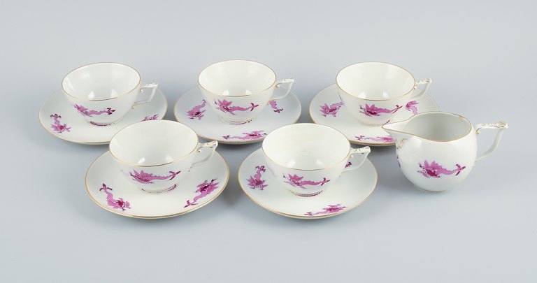 Meissen, Rich Court Dragon, a five-person purple tea service with gold 
decoration. Consisting of five pairs of teacups and a cream jug.