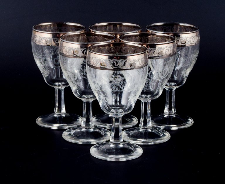 Murano, Italy, six mouth-blown and engraved port wine glasses with silver rim.