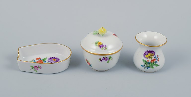 Meissen, Germany, three parts. Small lidded jar, pipe holder and miniature vase.