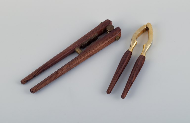 Two nutcrackers in Danish design, brass and teak.