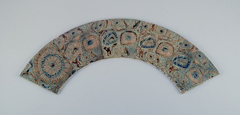Royal Copenhagen, five Baca faience tiles with patterned glaze in brown, blue, 
green and sand colours.