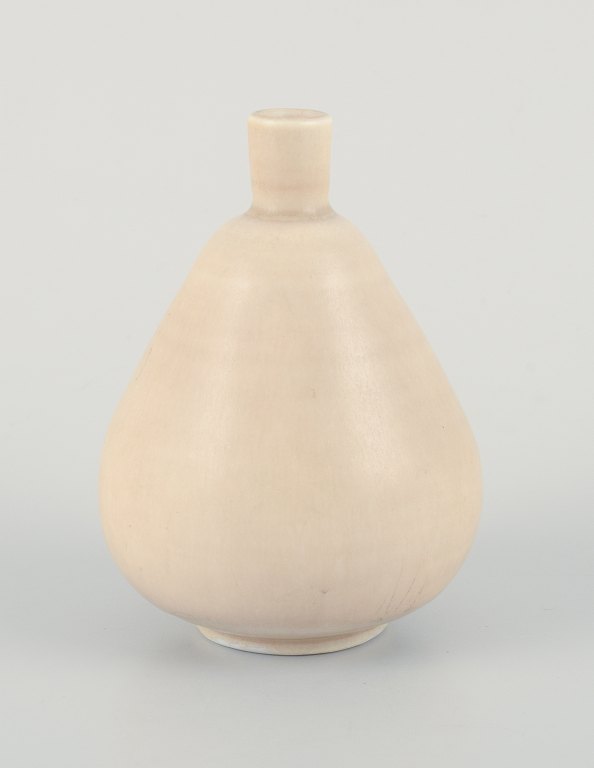 Gunnar Nylund for Rörstrand, Sweden, a small ceramic vase with a rare shape in 
cream-colored glaze.