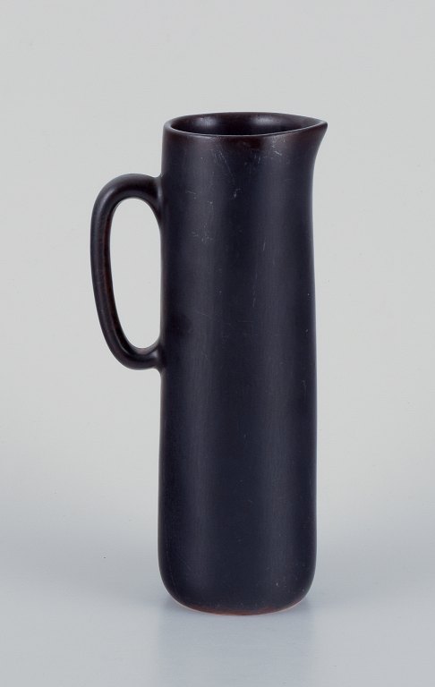 Carl Harry Stålhane for Rörstrand, ceramic jug with glaze in dark brown shades.