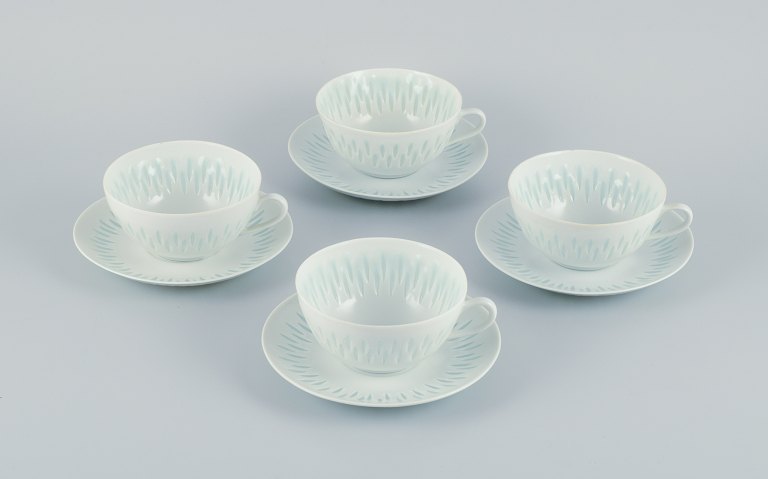 Friedl Holzer-Kjellberg for Arabia,  Finland, four pairs of large tea cups with 
saucers in rice porcelain.