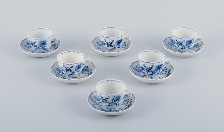 Meissen, Germany, a set of six pairs of Blue Onion pattern coffee cups with 
saucers. Hand-painted.