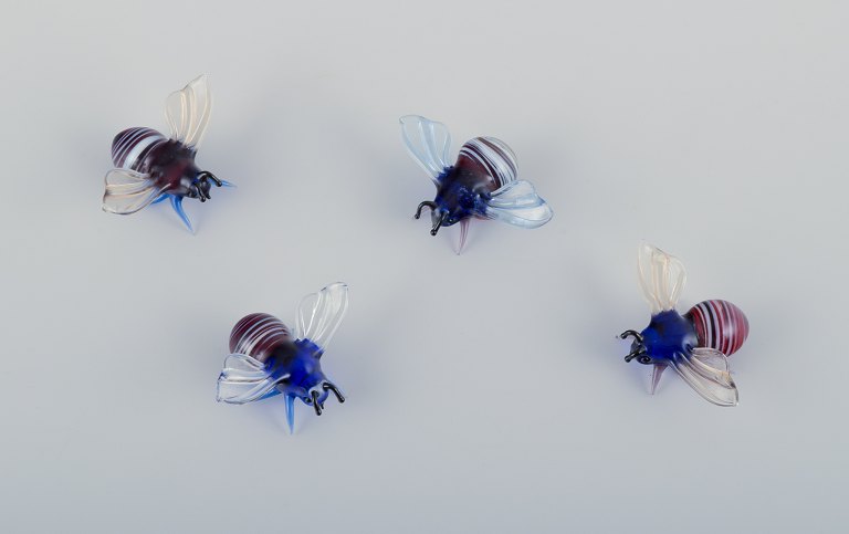 Murano, Italy. A collection of four miniature glass figurines of bees in colored 
art glass.