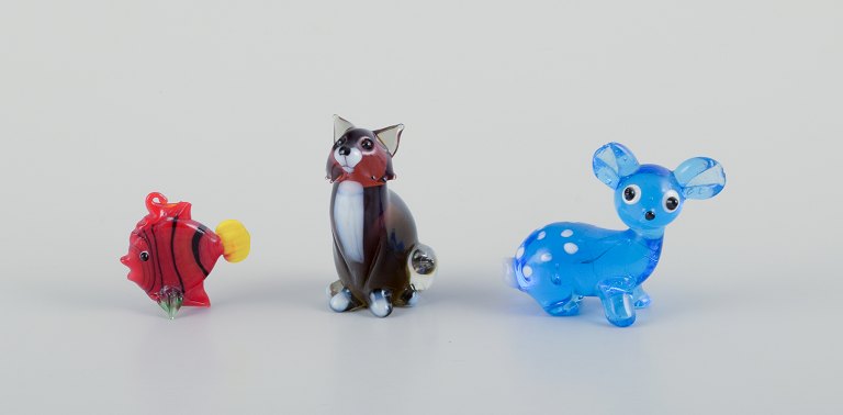 Murano, Italy. A collection of three miniature glass animal figurines consisting 
of a deer, fish, and fox in colored art glass.