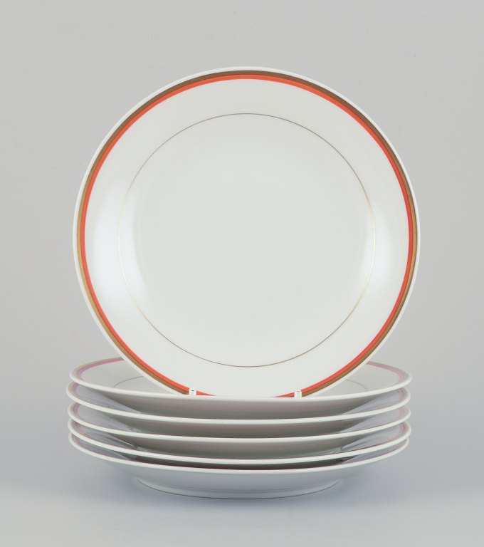 Meissen, Germany. A set of six plates. Orange and gold-decorated rim.