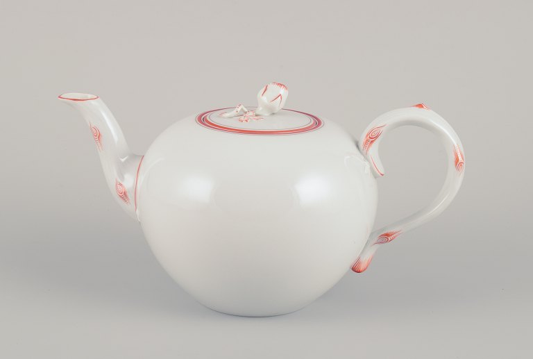 Meissen, Germany. Art Deco teapot decorated with coral red and gold-colored 
trim.