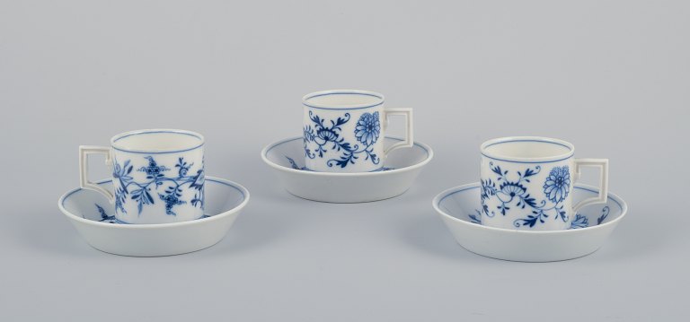 Meissen, Germany. Blue Onion. A set of three small chocolate cups with saucers. 
Hand-decorated with blue flowers.