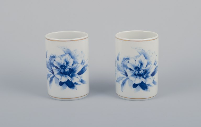 Meissen, Germany. Two vases. Hand-decorated with blue floral motifs, gold rim.