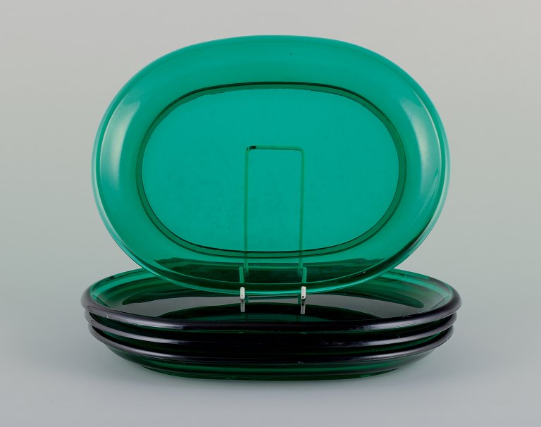 Josef Frank for Svenskt Tenn, Reijmyre/Gullaskruf,
Sweden. 
Four handmade lobster plates in green art glass.