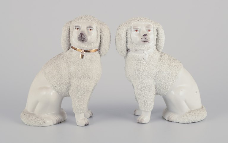Pair of antique English Staffordshire porcelain dogs.