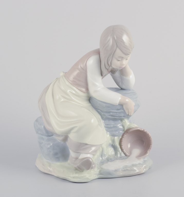 NAO, Spain.
Porcelain figurine of a girl taking a rest.